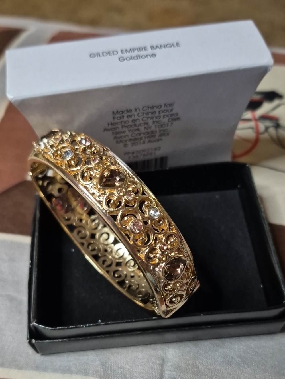 Avon Goldtone Filigree Bangle with Clear and Light Amber Stones
